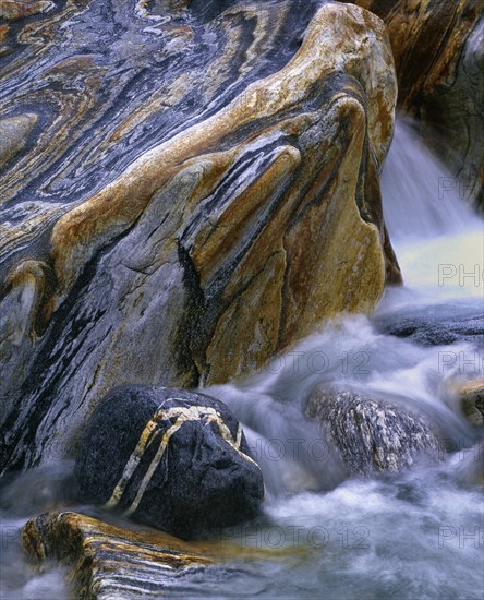 Stones with rock veins and running water