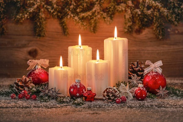 Natural advent decoration with 4 burning candles