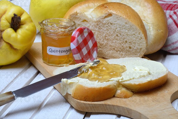 Slice of butter plait with quince jelly