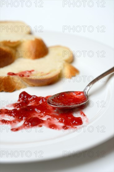 Jam and slice of braided butter