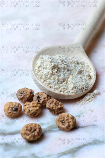 Tigernuts and tigernut flour in cooking spoon