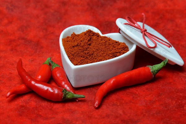 Chili powder in bowl with heart shape