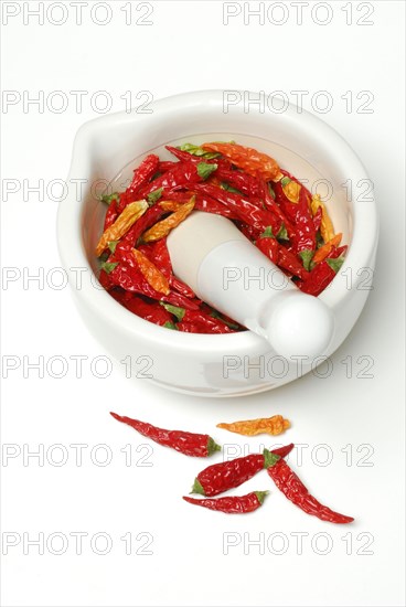 Dried chilli peppers in grating bowl