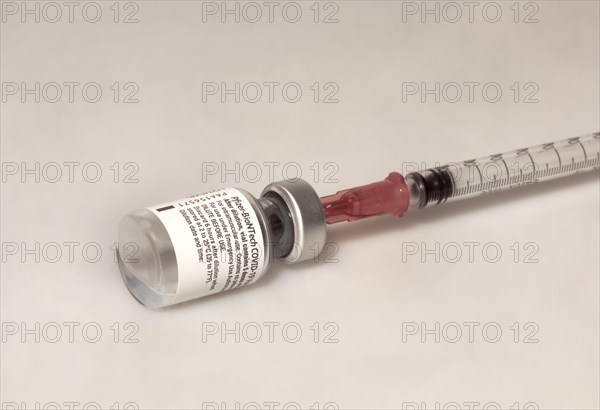 Vaccine Vial vs Covid 19 and Syringe