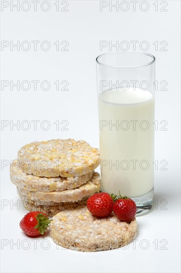 Corn and rice waffles with glass of milk and strawberries