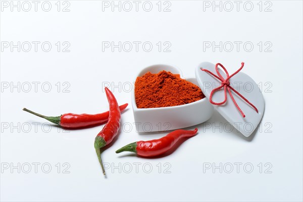 Chili powder in bowl with heart shape