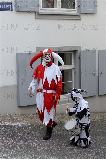 ( Basler Fasnacht) Carnivalist and child with drum, Basel, Switzerland, Europe