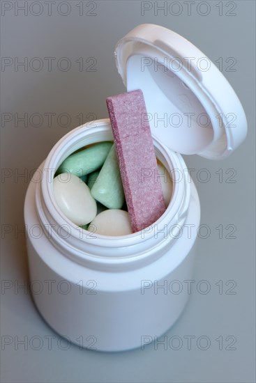 Various chewing gums in containers