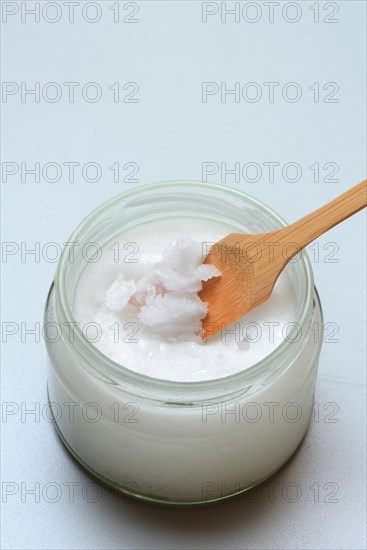 Coconut oil with bamboo spatula