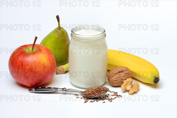 Yoghurt in glass with fruits and linseed