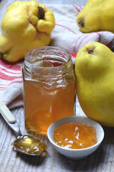 Quince jelly in glass with spoon