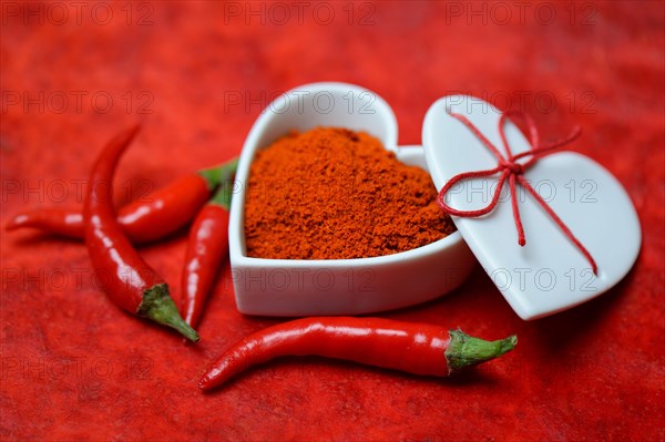 Chili powder in bowl with heart shape