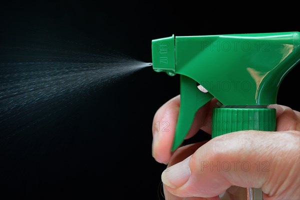 Spray bottle in hand