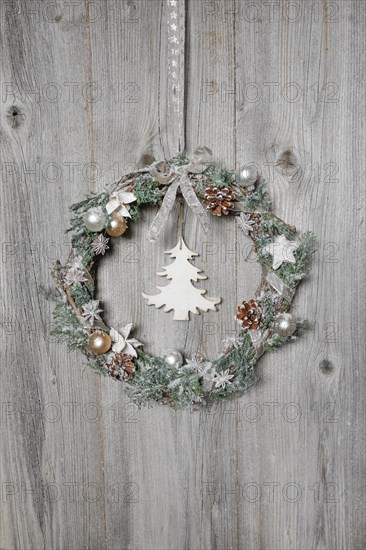 Christmas wreath on wooden wall