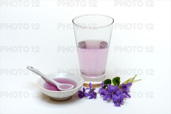 Violet syrup in bowl and glass