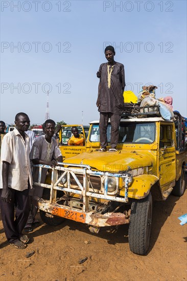 Old jeep off-road vehicle with local men