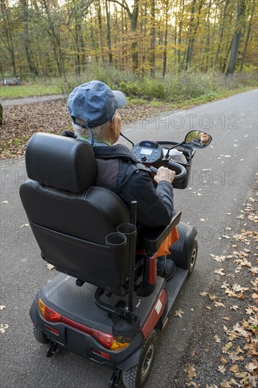 92-year-old pensioner rides electric wheelchair on road