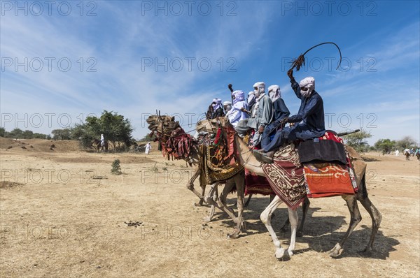 Colourful camel riders at a tribal festival