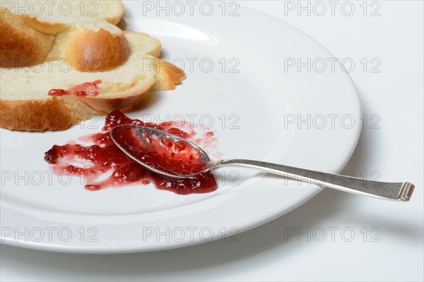 Jam and slice of braided butter