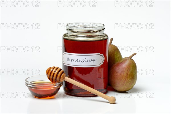 Pear syrup in glass jar and bowl