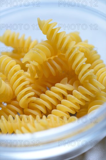 Spiral noodles in glass bowl