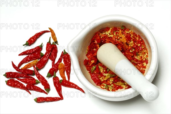 Dried chilli peppers in grating bowl