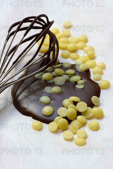 Cocoa butter and melted chocolate coating with whisk