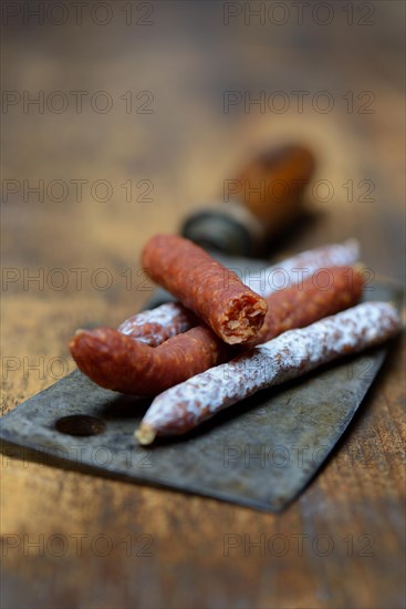 Different kinds of sausages on a chopper