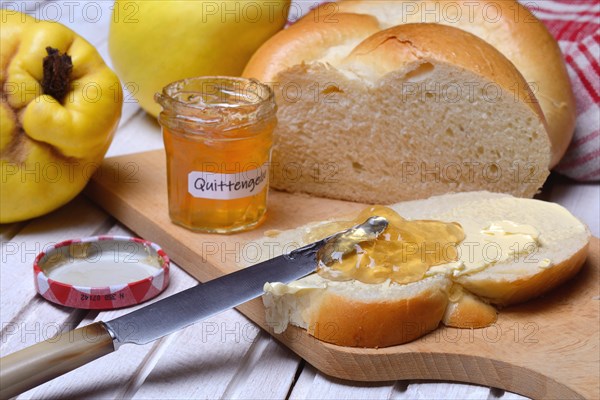 Slice of butter plait with quince jelly