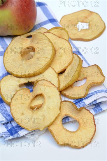 Dried apple slices and apples