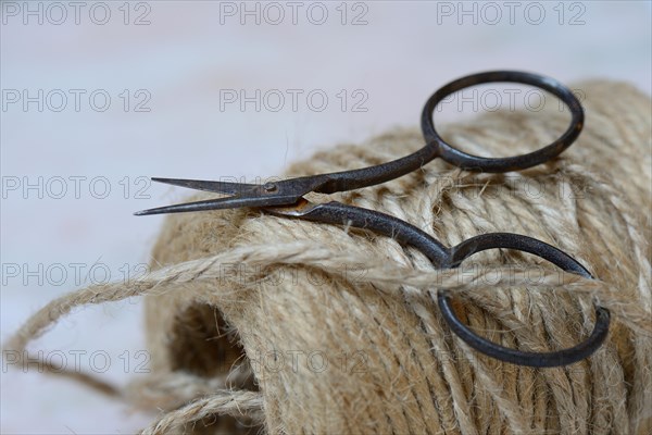 Roll of jute string and scissors