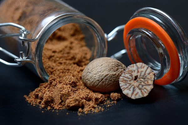 Nutmegs and nutmeg powder in glass containers