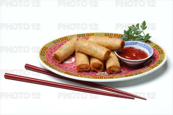 Spring roll and bowl with sauce