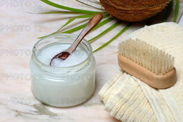 Coconut oil with wooden spoon