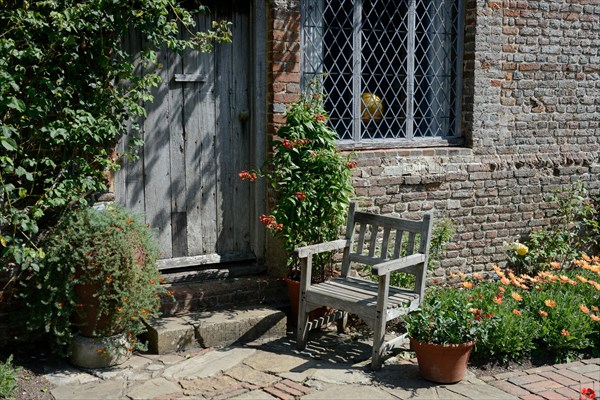 Garden chair in front of country house