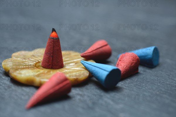 Burning incense cone