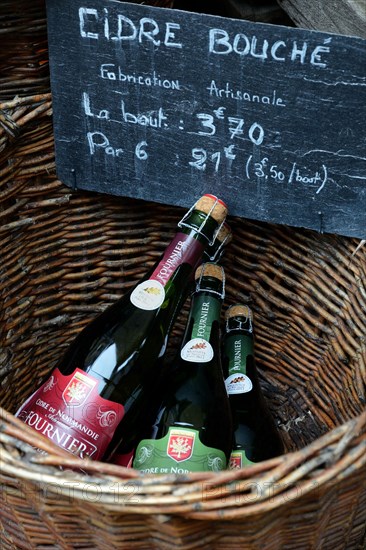 Basket with bottles of cider