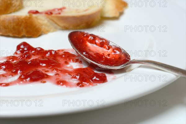 Jam and slice of braided butter