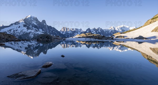 Mountain panorama with water reflection in Lac Blanc