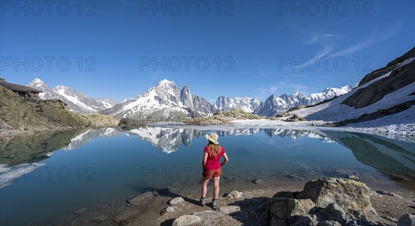 Young woman in front of mountain panorama