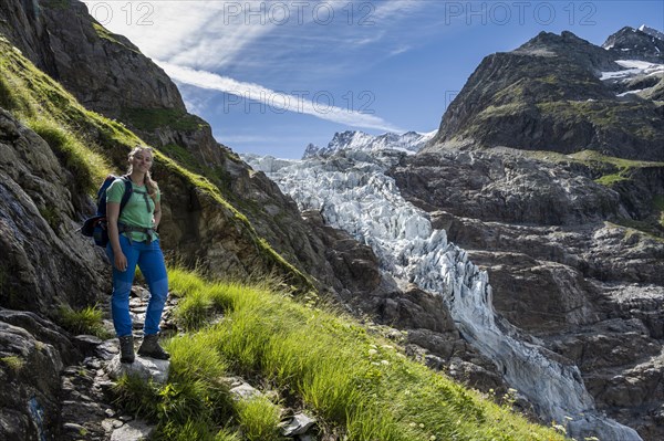 Hiker on the hiking trail to the Schreckhornhuette