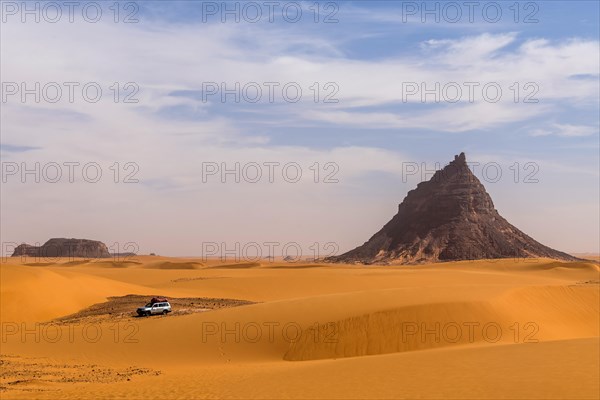 Expedition jeep driving through the desert