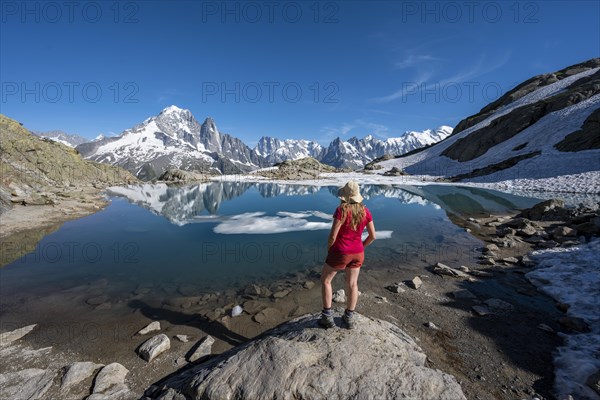 Young woman in front of mountain panorama