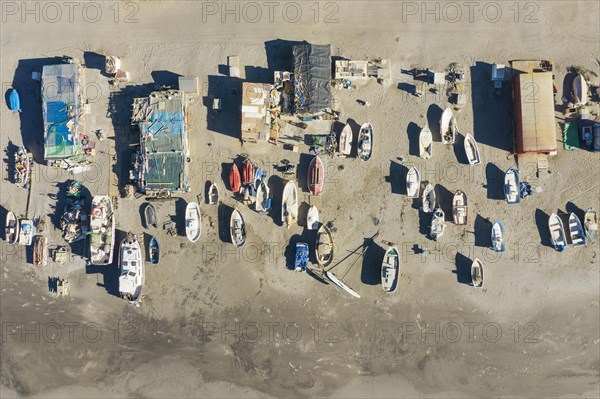 Fishing boats and fishermen cottages at the beach of San Miguel de Cabo de Gata