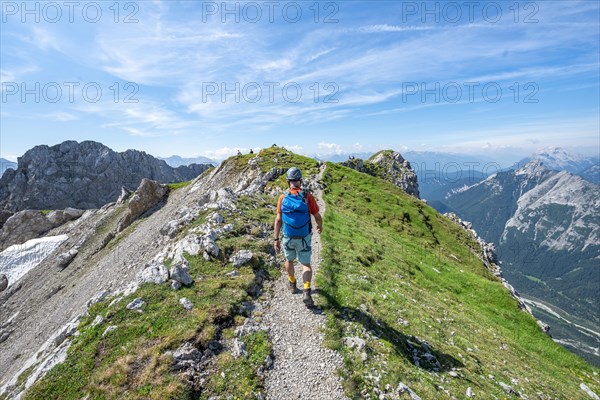 Mountaineer hiking on a ridge