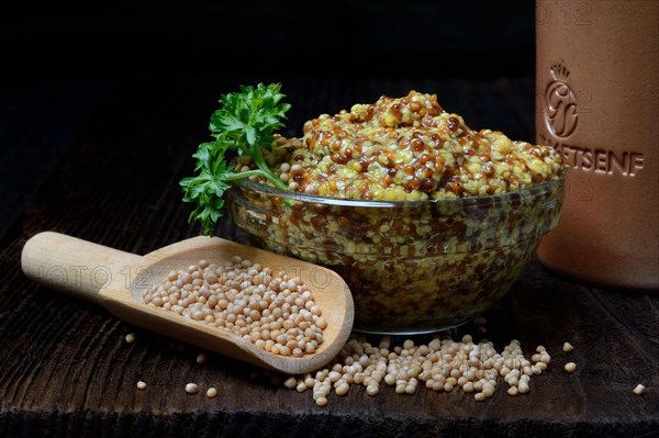 Grainy Dijon mustard in glass bowl