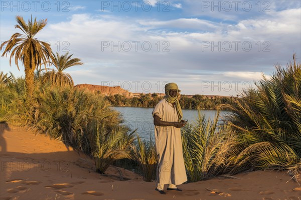 Beduin at the shore of Ounianga kebir part of the the Unesco sight Ounianga lakes