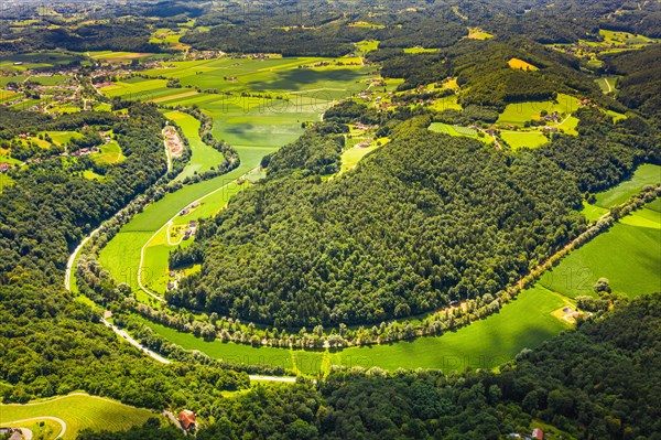 Aerial view of green hills and vineyards