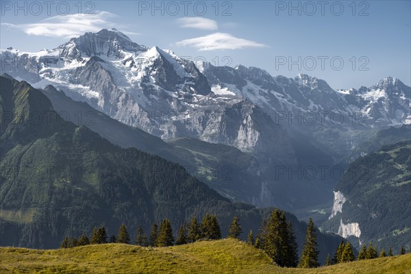 Snow covered mountain peaks behind Lauterbrunnen valley