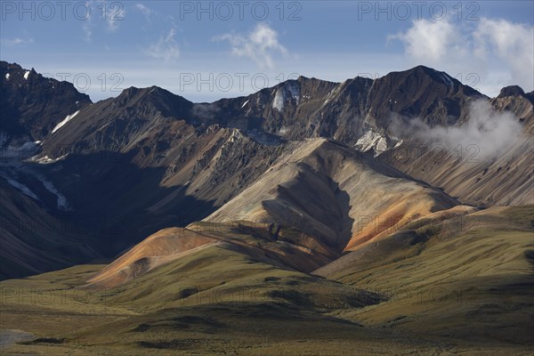 View of the Alaska Range with multicolored volcanic rock formations
